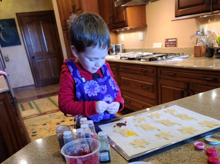 kid making Christmas cookies