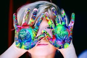 a child with painted hands