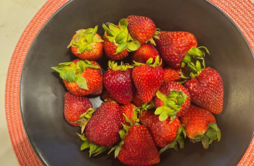 a plate full of strawberries